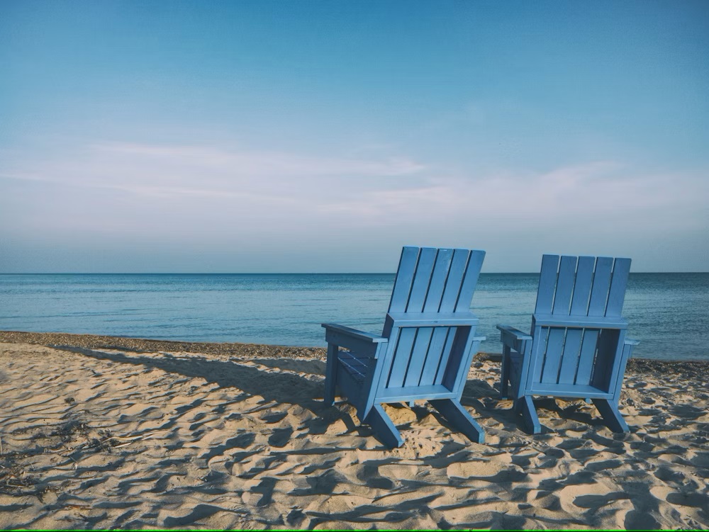 Blue chairs by the beach overlooking the sea - What to do in retirement, Happy retirement, Retirement Advice - pohernsi.com Buddha Temple Penang