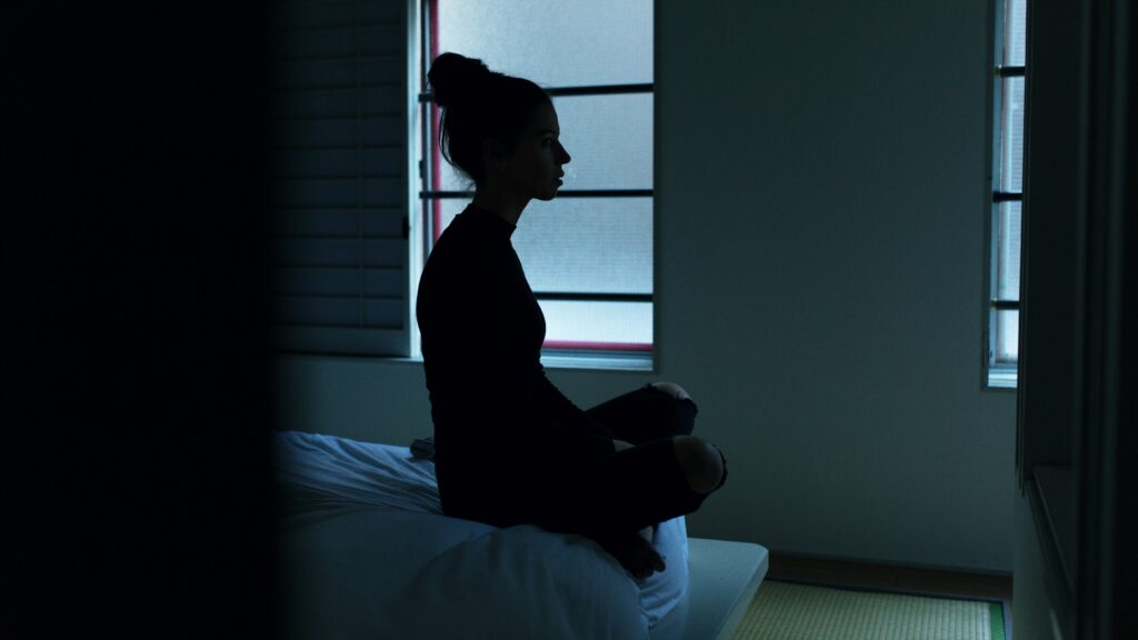 A lady having insomnia at night - How to live a stress free life - pohernsi.com Buddhist temple Penang